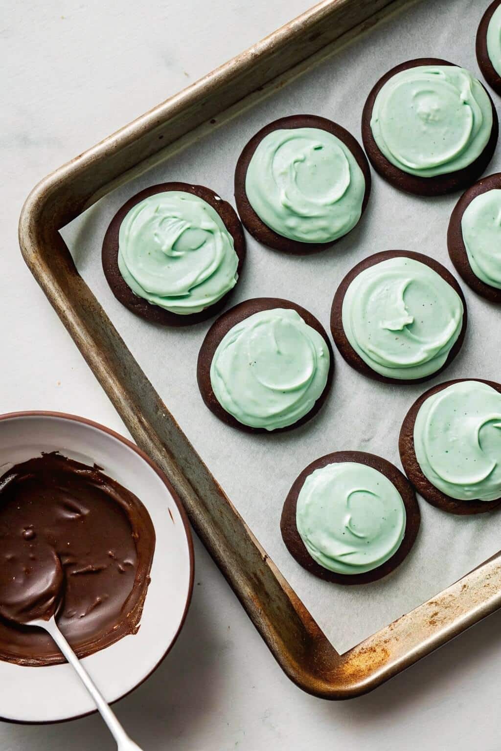 Whipping creamy mint frosting to perfection for a smooth and flavorful topping 2