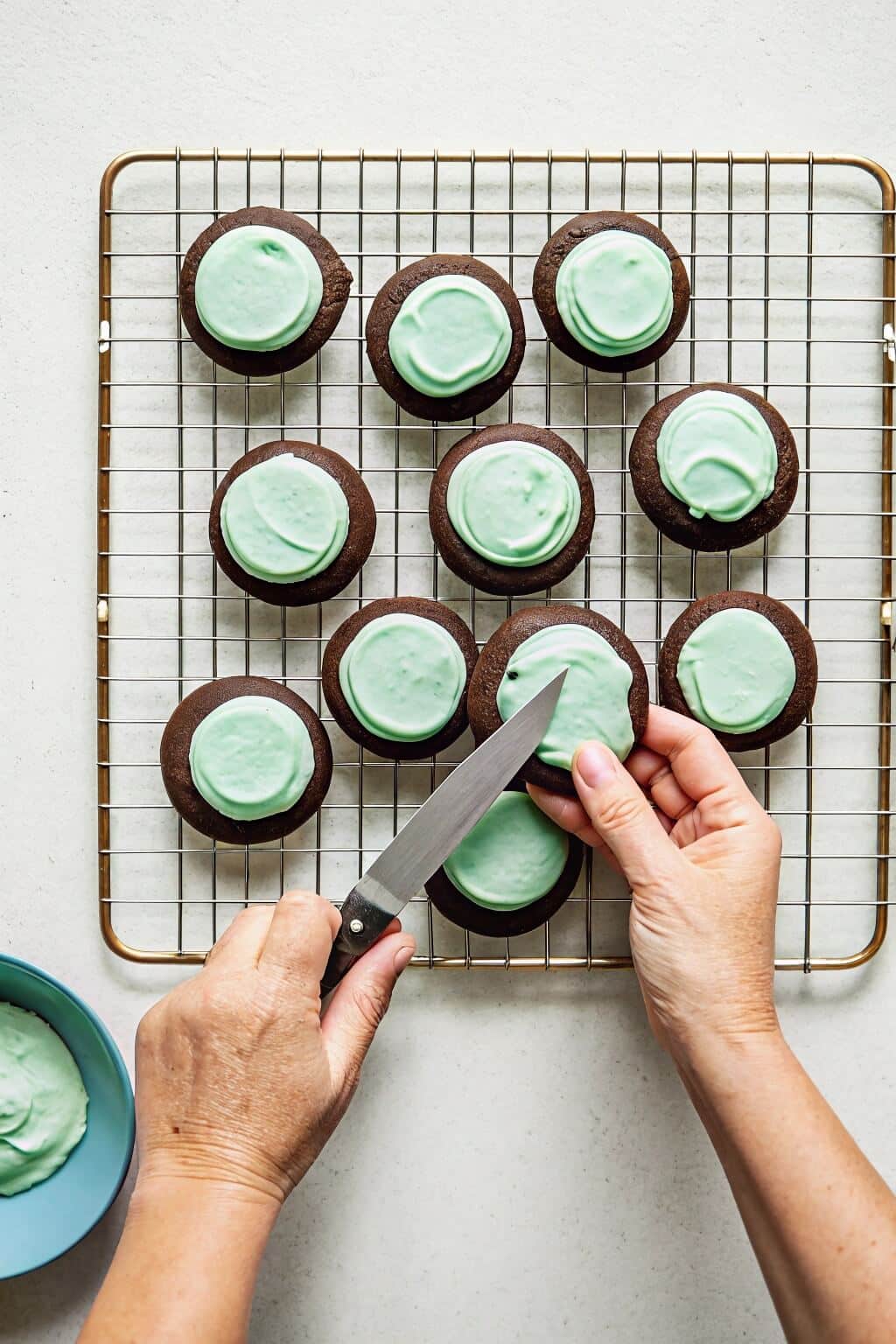 Whipping creamy mint frosting to perfection for a smooth and flavorful topping 1