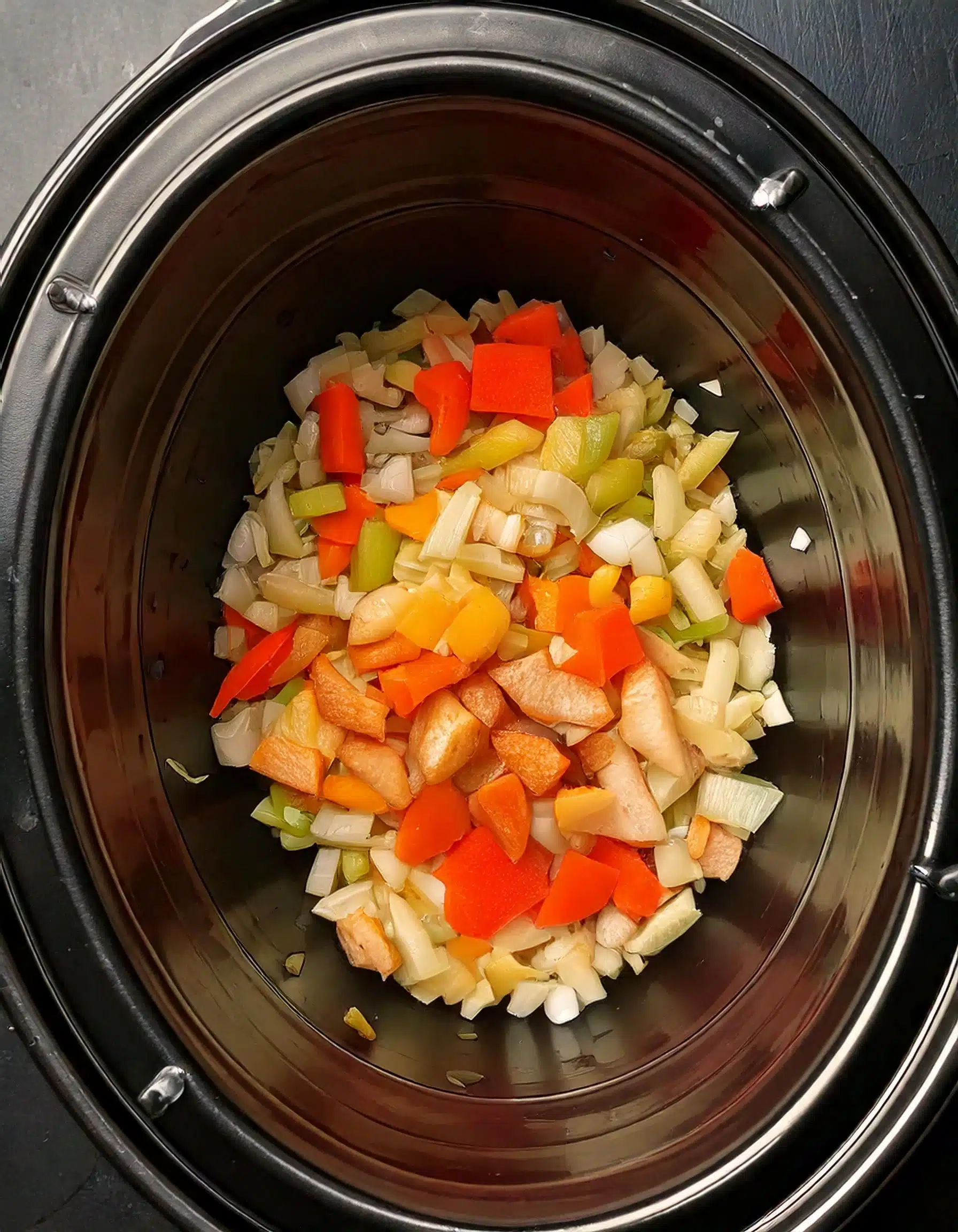 Sautéed carrots, celery, and onions in a crockpot.