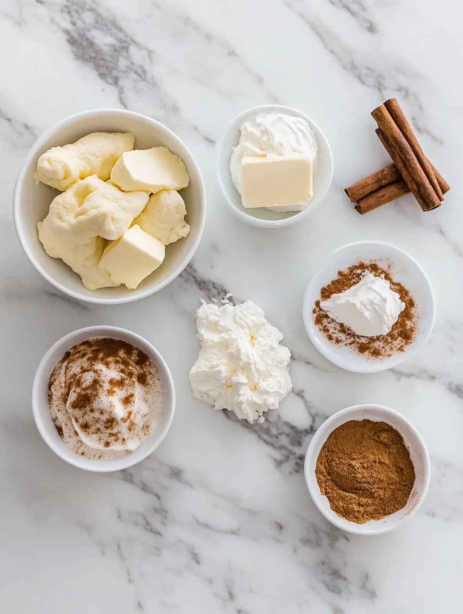 ngredients for baked churro cheesecake bars on marble